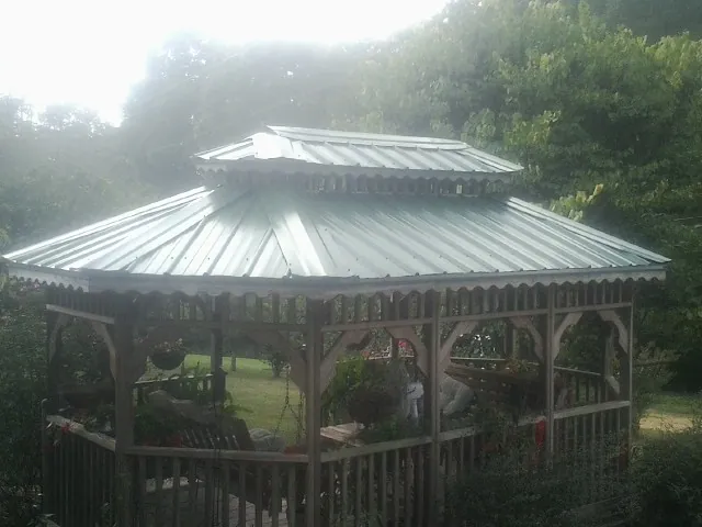 Two tier green metal roof on a garden gazebo in Trumbull